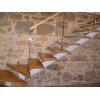 Escalera interior a medida con zanca central acero